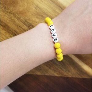 LOVE yellow glass beaded bracelet